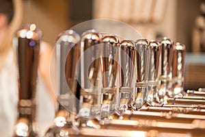 Silver metal taps at bar