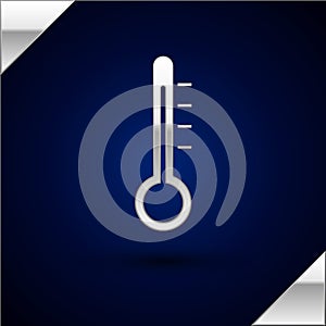 Silver Meteorology thermometer measuring icon isolated on dark blue background. Thermometer equipment showing hot or