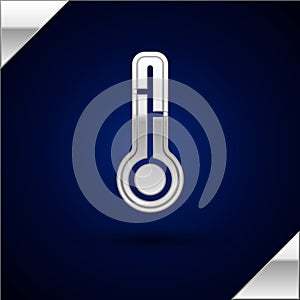 Silver Meteorology thermometer measuring icon isolated on dark blue background. Thermometer equipment showing hot or