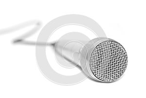 Silver microphone placed on a white background