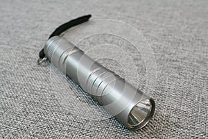 A Silver Mini LED flashlight