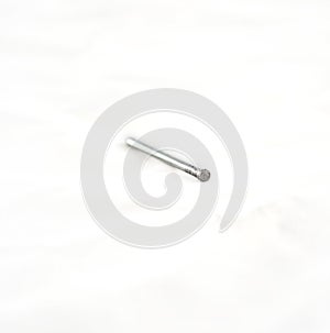 Silver nail on white.