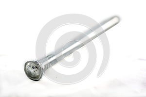 Silver nail on white.