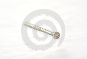 Silver nail on white background.