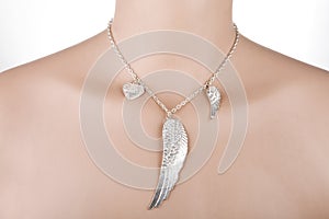 Silver necklace with angel wing and heart