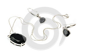 Silver necklace with black pendant & earrings isol