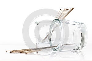 Silver needles for traditional Chinese acupuncture medicine. White background.