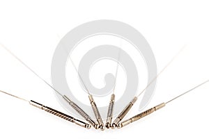 Silver needles for traditional Chinese medicine acupuncture. Close-up. Isolated on white background.
