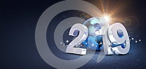 Silver New Year date 2019 composed with a blue planet earth, sun shining behind, on a glittering black background - 3D