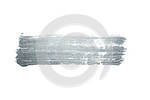 Silver paint brush stroke or abstract dab smear with silver glitter smudge texture on white background. Isolated glittering and sp