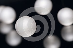 Silver pearl balls on a black background