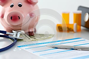 Silver pen lying on health application form at table