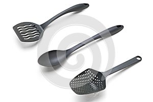 Silver plastic cooking utensils over white background