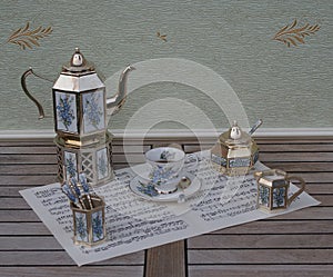 Silver-plated english tea set with a bouquet of forget-me-nots and lilies of the valley on hand-painted enamel inlays
