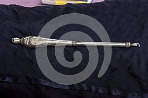 A silver pointer used to help the reader of the Torah scroll