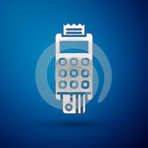 Silver POS terminal with inserted credit card and printed reciept icon isolated on blue background. NFC payment concept.  Vector