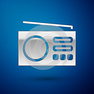 Silver Radio with antenna icon isolated on blue background. Vector