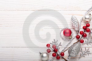 Silver red christmas gifts on white wooden background