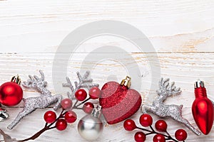 Silver red christmas gifts on white wooden background