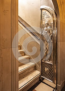 Silver relief door at the entrance to the stairway leading to the shrine of Our Lady of Montserrat.