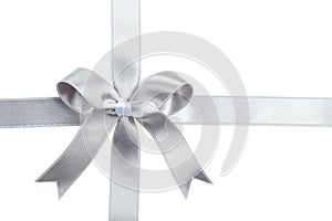 Silver ribbon with bow on white background.