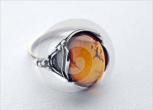 Silver ring and amber