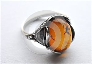 Silver ring and amber