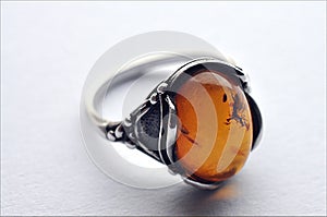Silver ring and amber