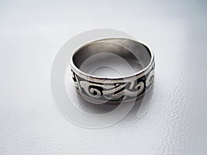 Silver ring on gray background