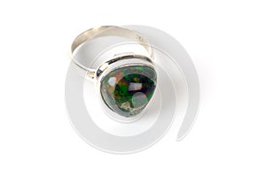 Silver ring with opal stone of green color.