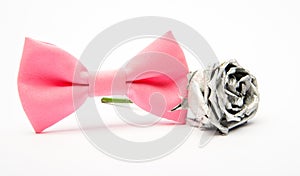 Silver rose flower and male bow tie isolated on white. Wedding accessories. Elegant look. Esthete detail. Modern formal