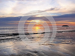 Silver Sandy Beach During a Sunset