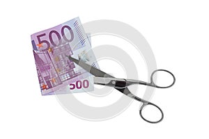 Silver scissors cutting folded five hundred 500 Euro banknote mo