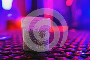 Silver Sequins for the design in a box at the disco show. Glitter in jars. Foil for women service. Sparkling beauty shimmer