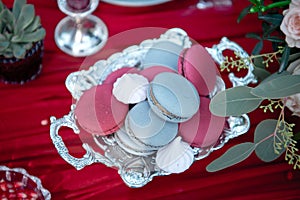 Silver serving dish with pomegranate and macarons