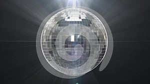 Silver shiny disco ball on black background