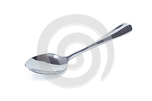 Silver shiny spoon isolated on white background. photo