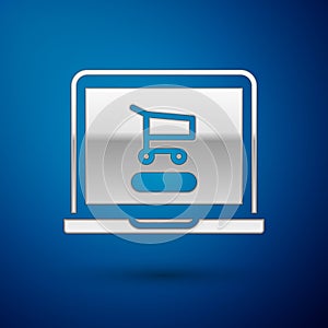 Silver Shopping cart on screen laptop icon isolated on blue background. Concept e-commerce, e-business, online business