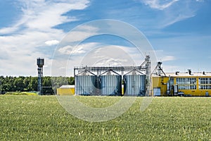 Silver silos on agro-processing and manufacturing plant for processing drying cleaning and storage of agricultural products, flour