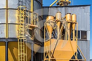 Silver silos on agro-processing and manufacturing plant for processing drying cleaning and storage of agricultural products, flour