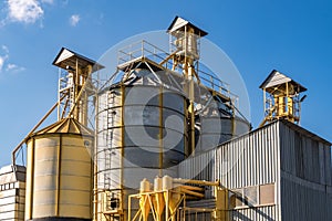 Silver silos on agro-processing and manufacturing plant for processing drying cleaning and storage of agricultural products, flour