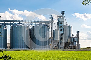 Silver silos on agro-processing and manufacturing plant for processing drying cleaning and storage of agricultural products, flour