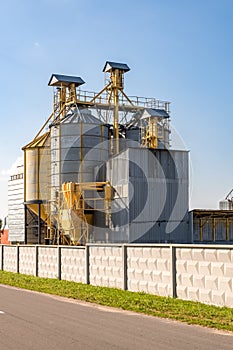 Silver silos on agro-processing and manufacturing plant for processing drying cleaning and storage of agricultural products, flour