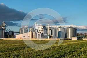 Silver silos on agro-processing plant for processing and storage of agricultural products, flour, cereals and grain