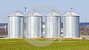 Silver silos in field