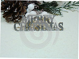 Silver sparkly Merry Christmas sign on snow