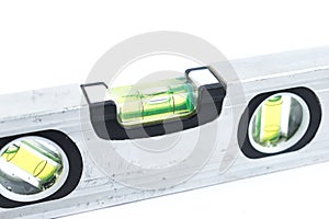 Silver spirit level isolated on white background. Construction tool. Metal small spirit lever. Repair tool.