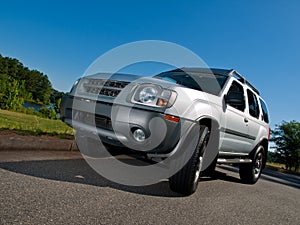 Silver Sports Utility Vehicle low pavement angle