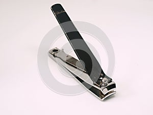 A silver stainless steel nail clipper on white background