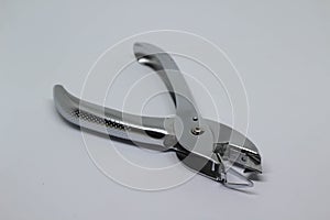 Staple remover on white background